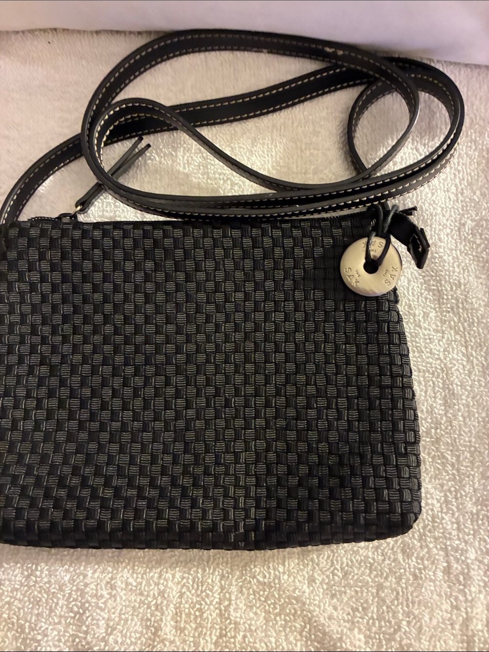 NWOT SAK Black basket-Woven Crossbody Bag in Black, signature silver logo charm